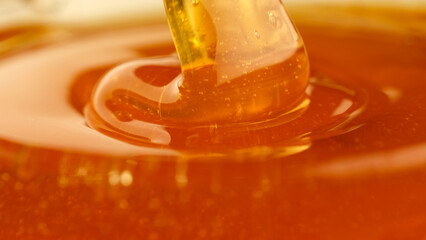 Poster - Pouring honey, flowing liquid sugar syrup. Thick Honey Dripping close up