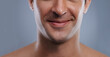 © Jeff Bergen/peopleimages.com - Man, mouth and smile with skincare and lips with hygiene, jawline and satisfaction with treatment closeup. Grooming, confidence and face with male model in studio background for cosmetic shave