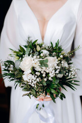 Wall Mural - Wedding flowers. Bridal bouquet with exotic flowers. Bride holding a bouquet. wedding details. soft focus