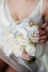 Wall Mural - Wedding flowers. Bridal bouquet with exotic flowers. Bride holding a bouquet. wedding details. soft focus