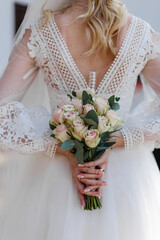 Wall Mural - Wedding flowers. Bridal bouquet with exotic flowers. Bride holding a bouquet. wedding details. soft focus