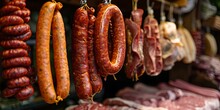 Assorted Hanging Sausages At A Traditional Market. Freshly Made, Ready For Sale. Culinary Delights Captured In Natural Light. Perfect For Food-related Content. AI