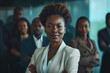 Portrait of a black businesswoman with a team