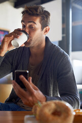 Poster - Phone, drinking and man with coffee at restaurant networking on social media, mobile app or internet. Research, technology and young male person reading on cellphone with cappuccino at cafe.