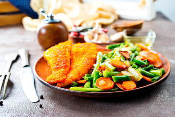 Wall Mural - fish fillet with mixed vegetables on plate