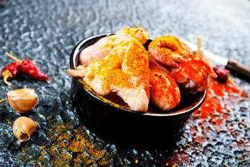 Poster - Raw Marinated chicken meat wings and legs for BBQ