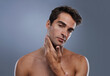 © Jeff Bergen/peopleimages.com - Portrait, glow and man with skincare, shaving and dermatology on grey studio background. Face, person and model with grooming routine and healthy skin with treatment, cosmetics and smooth with shine