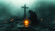 Cross in the light with a man kneeling in front of it. Dark, foggy landscape. 