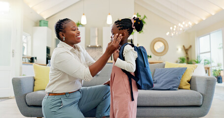 Poster - Talking, happy and a mother with a child getting ready for school in the morning. Kiss, laughing and an African mom helping a little girl with a bag in the living room of a house for kindergarten