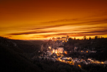 Wall Mural - Sun setting over the medieval city of Rocamaour in the Lot region of France