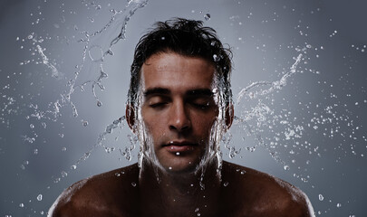 Wall Mural - Water splash, liquid and man wash face for bathroom routine, self care or beauty treatment. Eye closed, bathing and model headshot with hygiene, grooming and facial cleanse on dark grey background