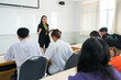 © EduLife Photos - Asian female university explaining lesson to the students in the classroom