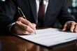 © Iftikhar alam - A professional man in formal attire sits at a desk and writes on a piece of paper, Man signing contract, AI Generated