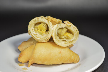 Wall Mural - Pisang molen, a typical Indonesian food made from bananas wrapped in a sheet of pastry dough and then deep-fried.