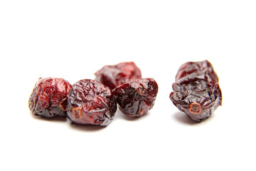 Wall Mural - Dried cranberries isolated on white background. Group of sweetened red cranberries closeup