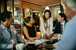 © Marko Geber - Diverse business people talking in cafe or bar