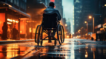 A Person In A Wheelchair Crossing The Road 
