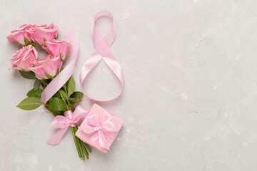 Wall Mural - Composition with pink roses, gift box and eight made of ribbon on concrete background, top view. Women's day concept