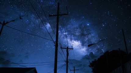 Wall Mural - Silhouette of suburban street lights with the dramatic Milky Way star cluster and nebula clouds in the background