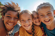 © Bela - A heartwarming portrait capturing a group of diverse, cheerful, and happy children of various ethnic backgrounds enjoying outdoor activities together.Diversity Conecpt