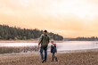 © kieferpix - Young father and son child spending time together walking talking in a beautiful nature setting