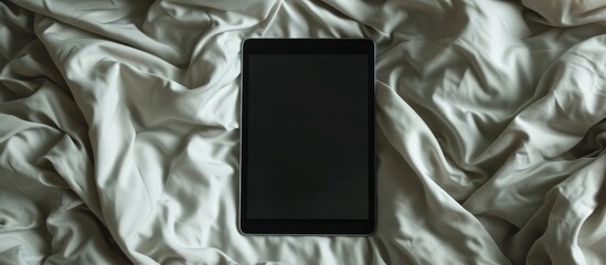 Sticker - Empty Screen Tablet on Crumpled Bed - Top View of an Empty Screen Tablet on a Crumpled Bed - Top View of an Empty Screen Tablet on a Crumpled Bed