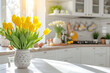 © fahrwasser - White kitchen decorated for Easter with yellow spring flowers and colored Easter eggs and copy space