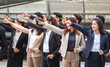 Business people success team pointing to the target blurred city street background, Success and Happiness Teamwork concepts