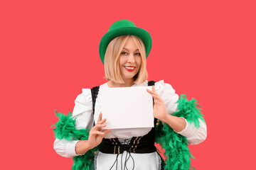 Poster - Woman in costume for St. Patrick's Day celebration holding blank card on red background