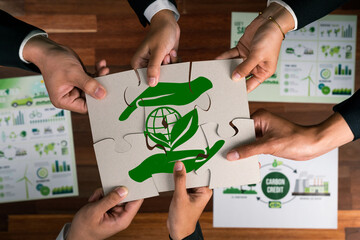 Wall Mural - Top view cohesive group of business people forming jigsaw puzzle pieces in environmental awareness symbol as eco corporate responsibility as sustainable solution for greener Earth. Quaint