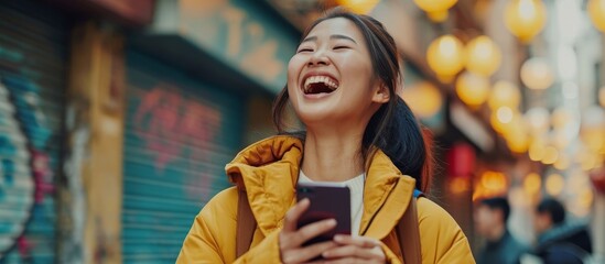 Poster - Joyful Asian Woman Happily Watches Mobile Phone in Satisfaction.