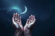 Moslem hand open and praying for dua under the crescent moonlight at night, praying tahajjud