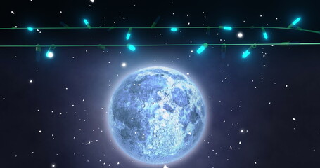 Wall Mural - blue christmas string lights flashing over falling snow and full moon in night sky