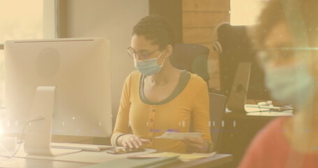 Poster - Spots of light against african american woman working at office