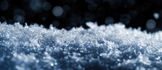 Poster - Close-up macro snow texture with snowflakes on black background, suitable for holiday gift cards.