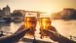 Two hands with glasses of beer on the background of the sunset. Generative AI