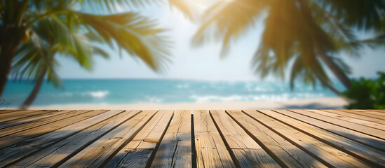 Wall Mural - Wooden deck with a sea background, overlooking the beach and ocean. A tropical wooden deck extends into the seafront at the beach, complemented by a backdrop of the ocean and palm trees.