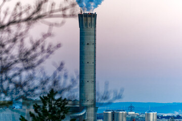 Wall Mural - View over Swiss City of Zürich with skyline and chimney with smoke of incineration plant on a sunny winter morning. Photo taken January 27th, 2024, Zurich, Switzerland.