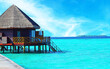 Water villas stand abreast in Maldivian sea 4