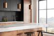 © ImageFlow - Modern home kitchen interior with bar island and cooking space near window