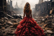 Woman in a lush evening dress on the ruins of a war-torn city