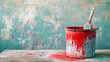 Bucket with red paint brush on empty wall background. Home improvement renovation interior decoration concept