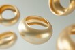 gold torus shapes floating against neutral background