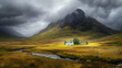 Gray clouds over Glen Coe with lone house standing