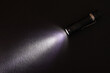 © eliosdnepr - Flashlight and beam of light on a dark background