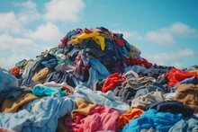 Piles Of Discarded Clothing And Fashion Waste In Landfill