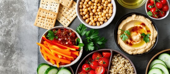 Wall Mural - Snack platter with hummus, veggies, grain salad, crackers.