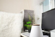 © yta - Air humidifier in the office, water vapor on the work table, modern workplace