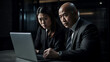 © Moritz - Collaborative Synergy in Diversity: Enthusiastic Latin Businessman and Asian Businesswoman Engaging in Productive Partnership, United in Strategy and Innovation over Laptop in Corporate Office Setting