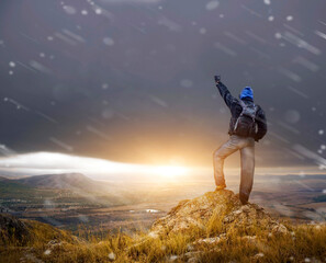 Canvas Print - Man on peak of mountain.